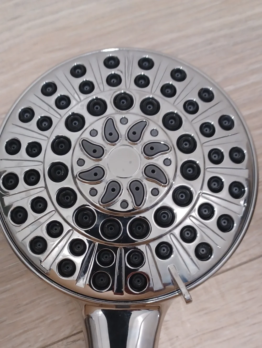 Bundle of chrome shower heads with flexible hose. Bath. Hand held.